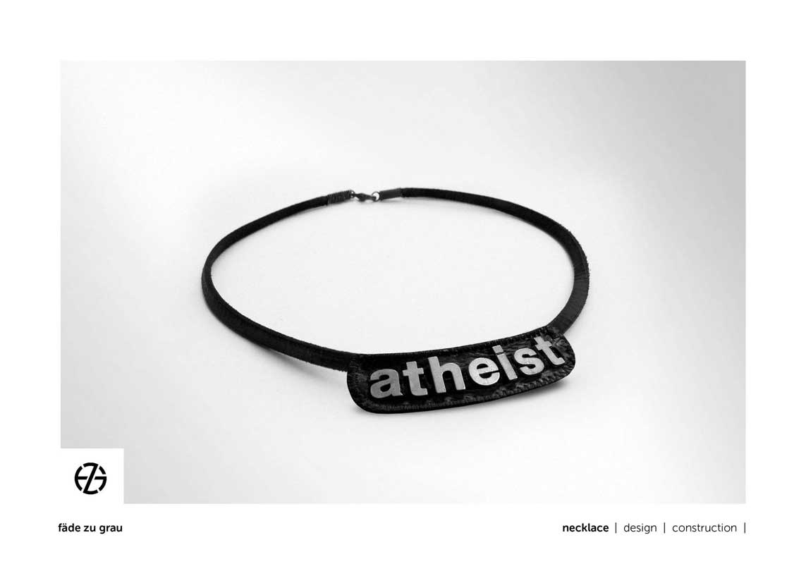 black leather band necklace with metal letters spelling "atheist"